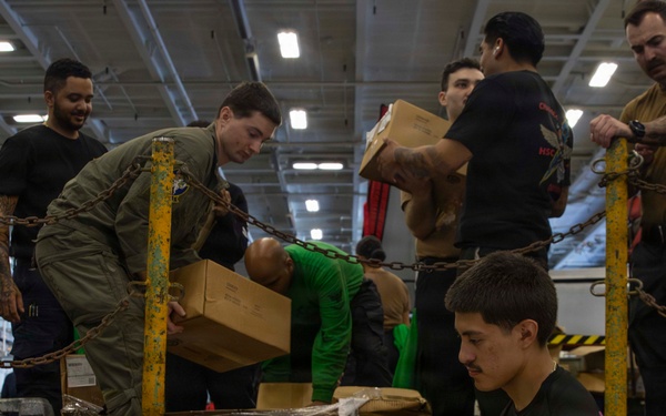 Abraham Lincoln conducts a replenishment-at-sea with Yukon