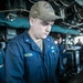 USS Mitscher (DDG 57) junior officer stands watch in bridge