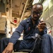 USS Mitscher (DDG 57) Sailor calibrates temperature switch