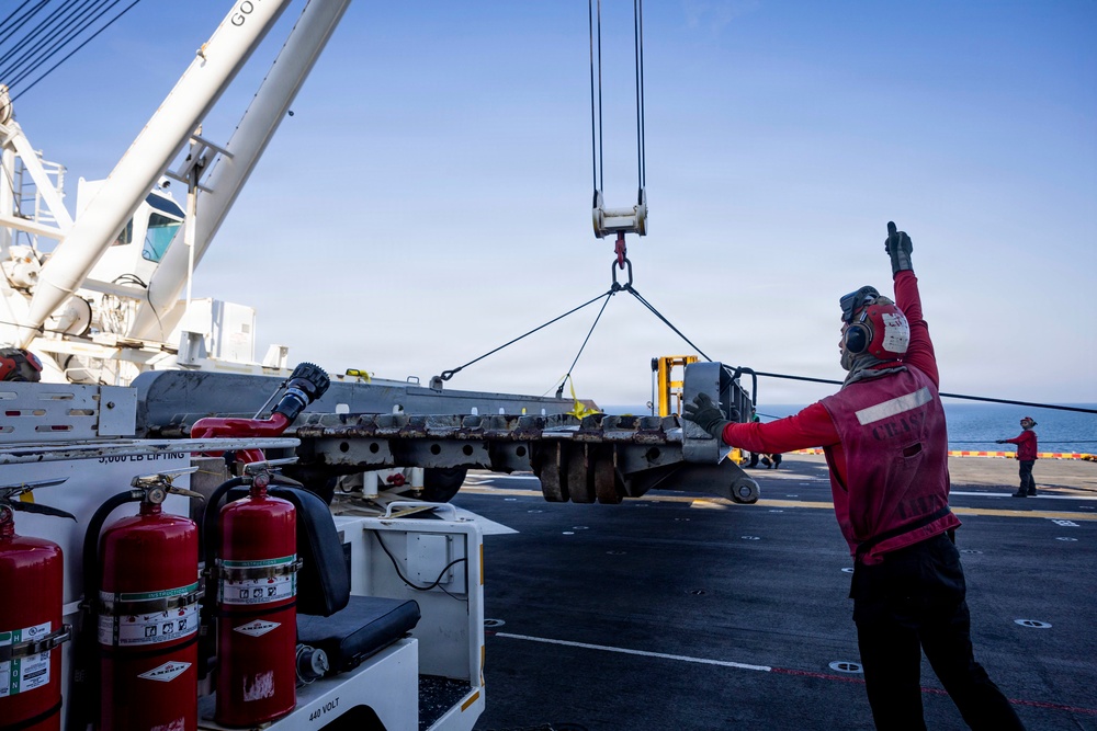 USS Iwo Jima Sailors Direct Crane