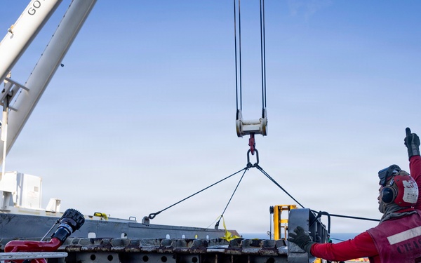 USS Iwo Jima Sailors Direct Crane