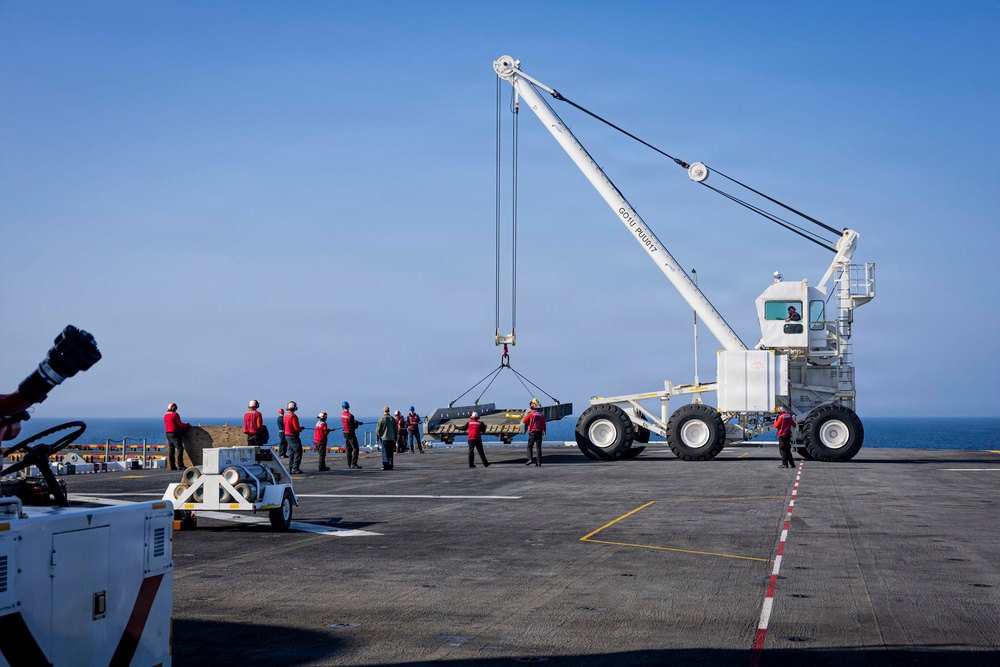 USS Iwo Jima Sailors Direct Crane