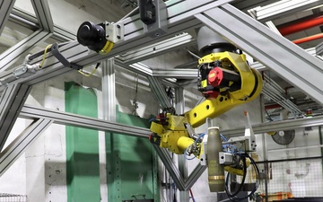 155mm projectile being moved by automated systems down the line for refurbishment at Blue Grass Army Depot