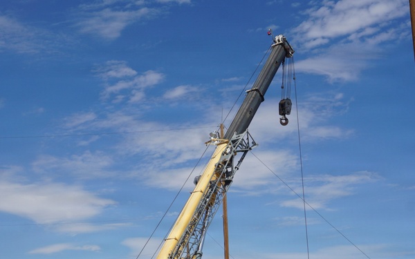 Crane operator loading projectiles for transport at Tooele Army Depot
