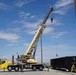 Crane operator loading projectiles for transport at Tooele Army Depot