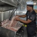Culinary Specialists prepare dinner for the crew aboard USS Bulkeley (DDG 84)