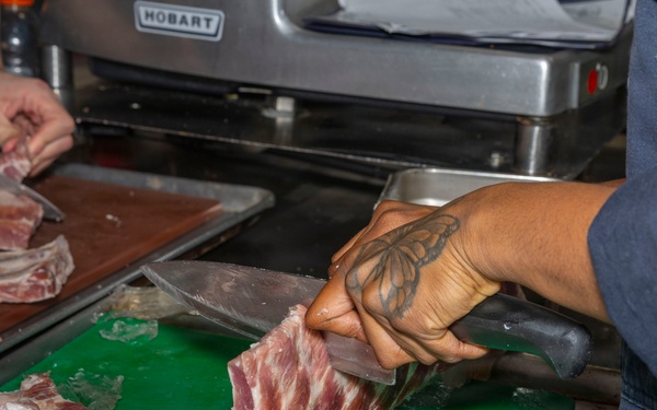 Culinary Specialists prepare dinner for the crew aboard USS Bulkeley (DDG 84)