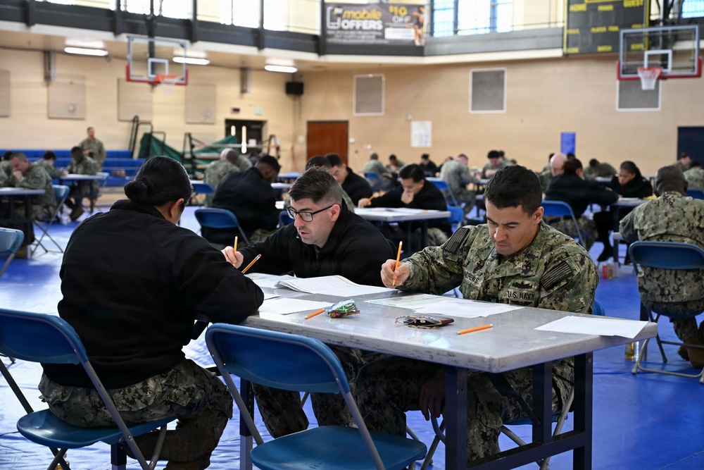 Sailors assigned to NMRTC Bethesda and other tenant commands take the Navy Wide E-7 Advancement