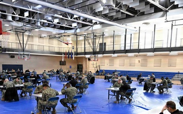 Sailors assigned to NMRTC Bethesda and other tenant commands take the Navy Wide E-7 Advancement