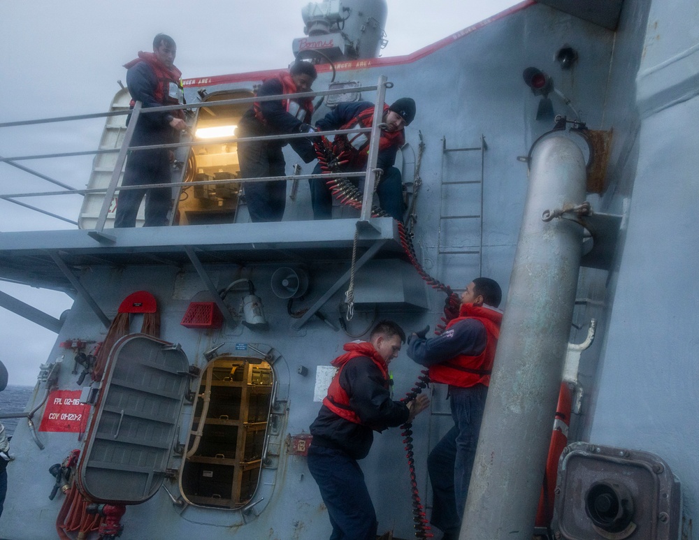 Sailors load ammunition aboard USS Bulkeley (DDG 84)