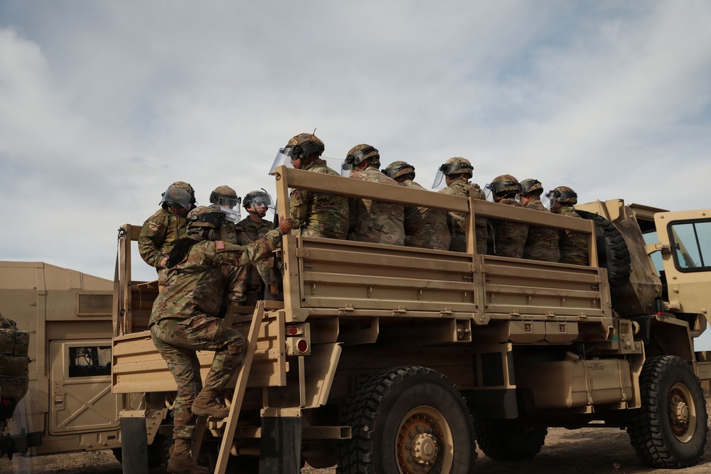 1-153rd Cavalry Regiment integrates UH-60L Black Hawks and LMTVs during QRF riot control training