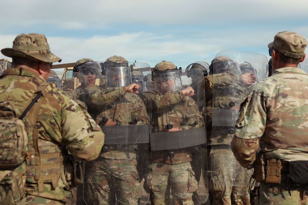 1-153rd Cavalry Regiment integrates UH-60L Black Hawks and LMTVs during QRF riot control training