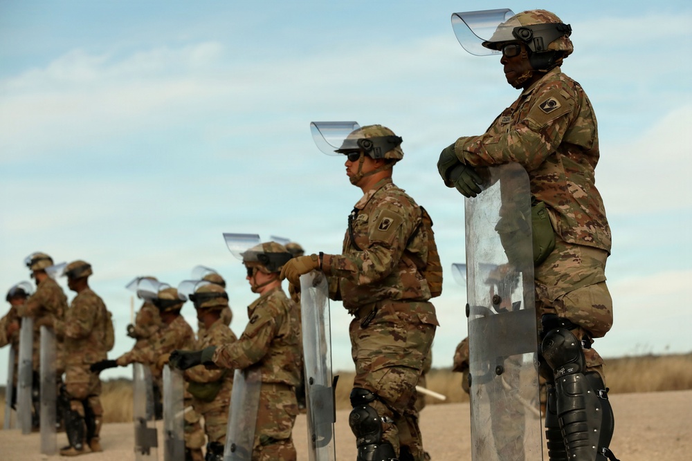 1-153rd Cavalry Regiment integrates UH-60L Black Hawks and LMTVs during QRF riot control training
