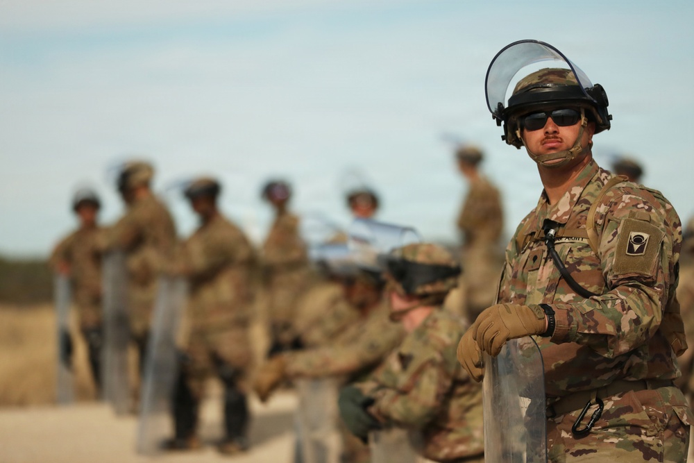 1-153rd Cavalry Regiment integrates UH-60L Black Hawks and LMTVs during QRF riot control training