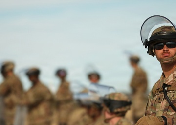 1-153rd Cavalry Regiment integrates UH-60L Black Hawks and LMTVs during QRF riot control training
