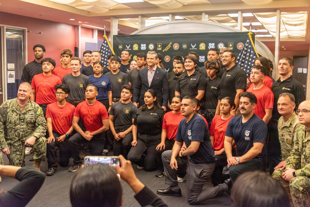 Secretary of War Pete Hegseth administers the oath of enlistment to Coast Guard and other military recruits in Southern California