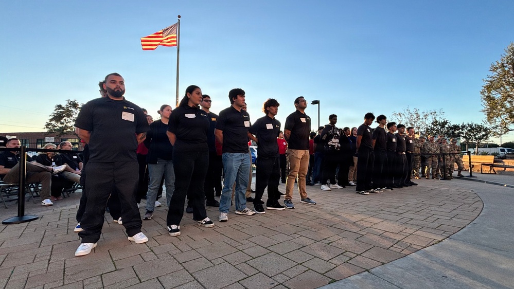Secretary of War Pete Hegseth administers the oath of enlistment to Coast Guard and other military recruits in Southern California