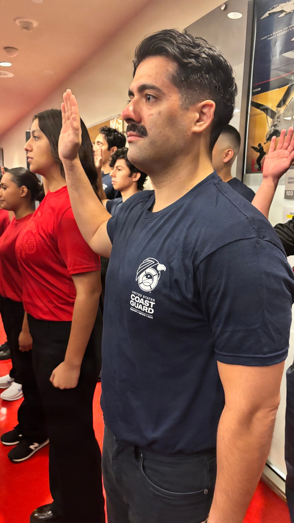 Secretary of War Pete Hegseth administers the oath of enlistment to Coast Guard and other military recruits in Southern California