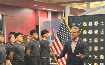 Secretary of War Pete Hegseth gives the oath of enlistment to Coast Guard and other military recruits in Southern California