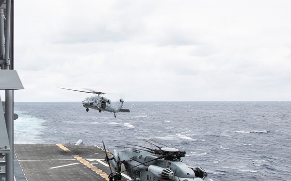 USS Tripoli Conducts Flight Operation with HSC 25