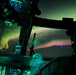Alaska Army National Guardsmen conduct a nighttime medical evacuation mission