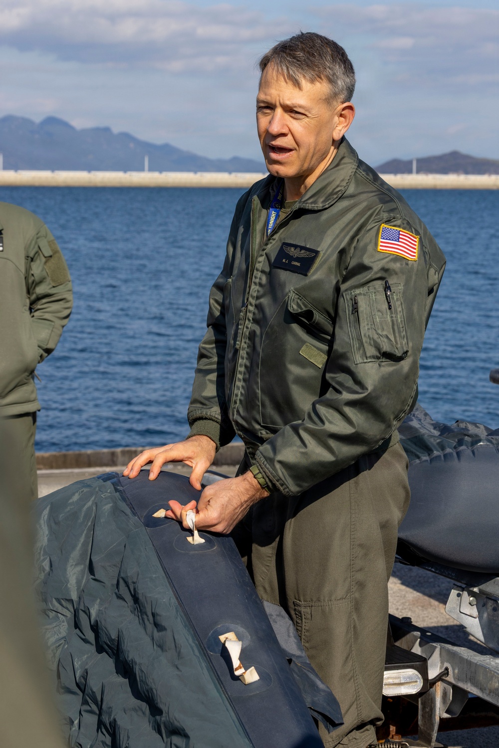 U.S. Marines practice with water survival gear in harbor