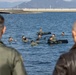 U.S. Marines practice with water survival gear in harbor