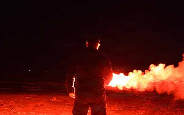 Coast Guardsman Trains with Light Flare