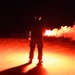 Coast Guardsman Trains with Light Flare