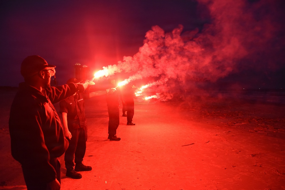 Coastguardsmen Train with Light Flares