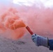 Coastguardsman Trains with a Smoke Flare