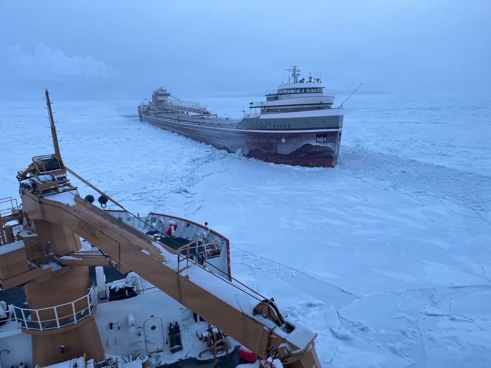 Coast Guard Cutter Mackinaw (WLBB 30) frees vessel from ice on Lake Huron