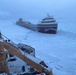 Coast Guard Cutter Mackinaw (WLBB 30) frees vessel from ice on Lake Huron