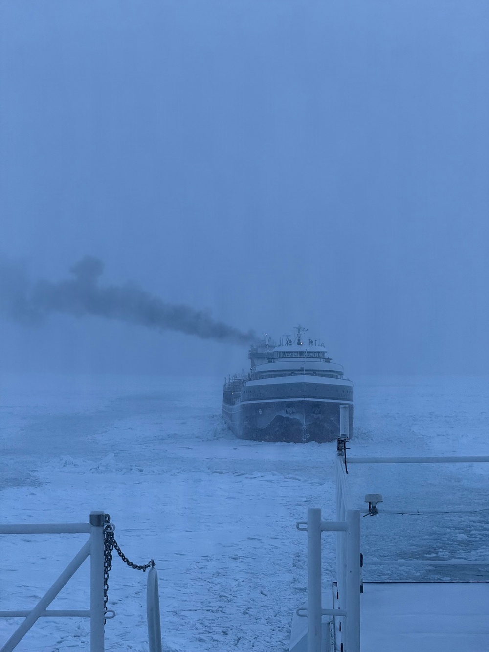 Coast Guard Cutter Mackinaw (WLBB 30) frees vessel from ice on Lake Huron