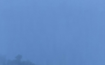 Coast Guard Cutter Mackinaw (WLBB 30) frees vessel from ice on Lake Huron