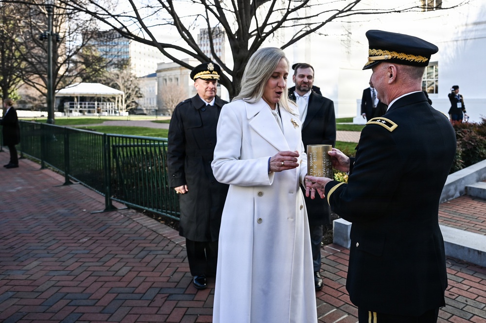 AG presents casing from 19-gun salute to Gov. Spanberger