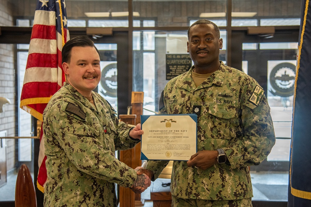 Electrician's Mate 1st Class Witt receives Navy and Marine Corps Achievement Medal at end of SWESC tour