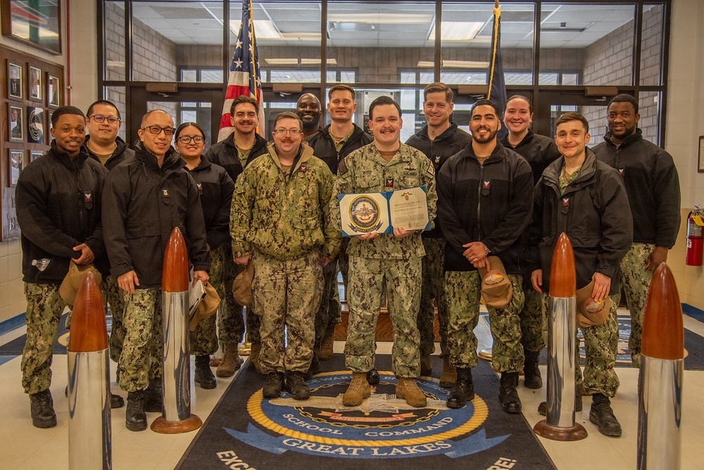 Electrician's Mate 1st Class Witt receives Navy and Marine Corps Achievement Medal at end of SWESC tour