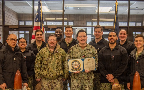 Electrician's Mate 1st Class Witt receives Navy and Marine Corps Achievement Medal at end of SWESC tour