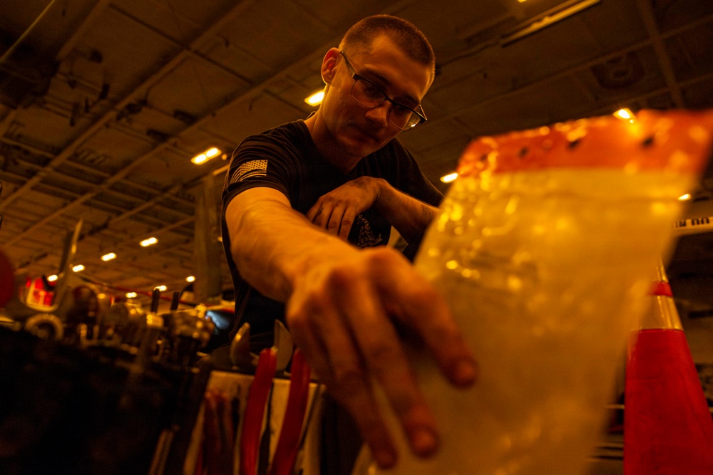 Abraham Lincoln conducts routine aircraft maintenance
