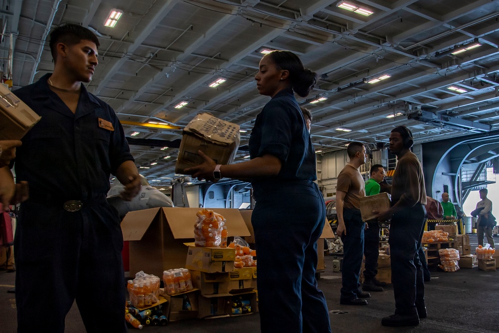 Abraham Lincoln conducts a replenishment-at-sea with Henry J. Kaiser