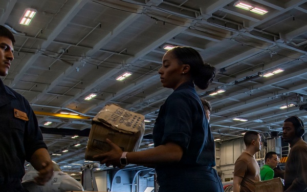 Abraham Lincoln conducts a replenishment-at-sea with Henry J. Kaiser