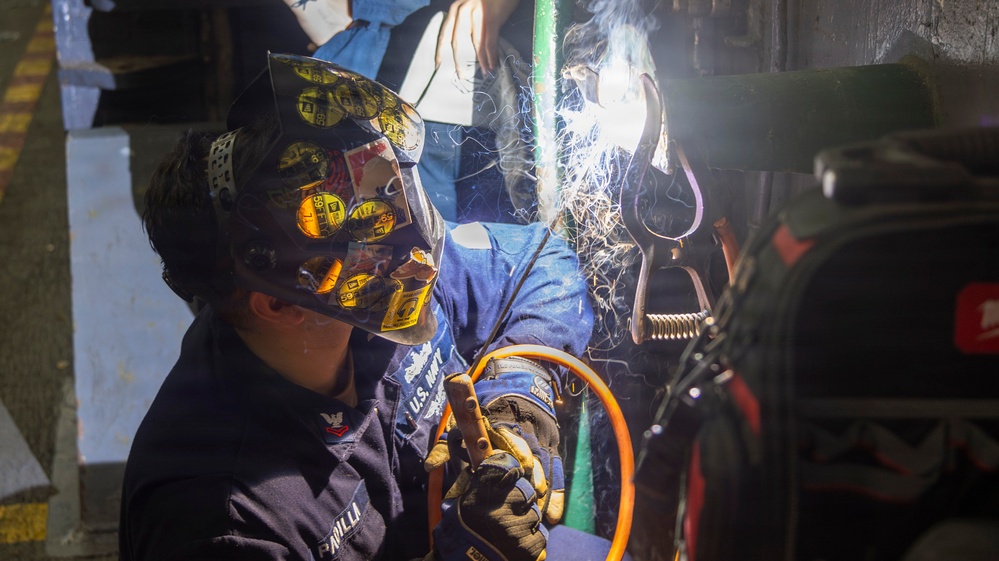 Abraham Lincoln conducts routine maintenance