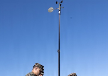 III Marine Expeditionary Force meteorology and oceanography analyst forecasters set up weather sensor