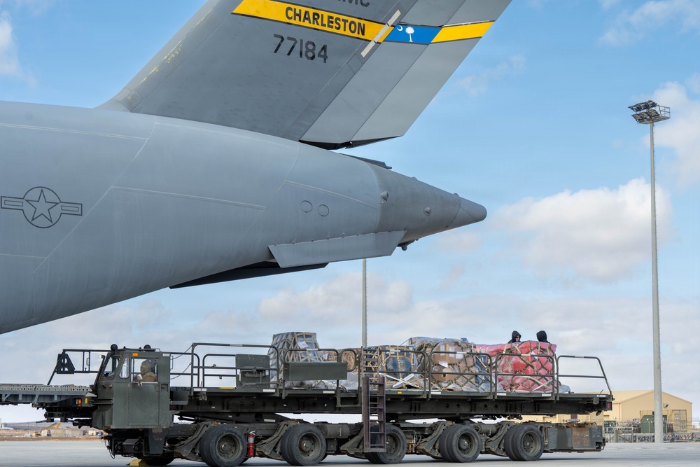 332nd Expeditionary Logistics Readiness Squadron loads pallets on C-17