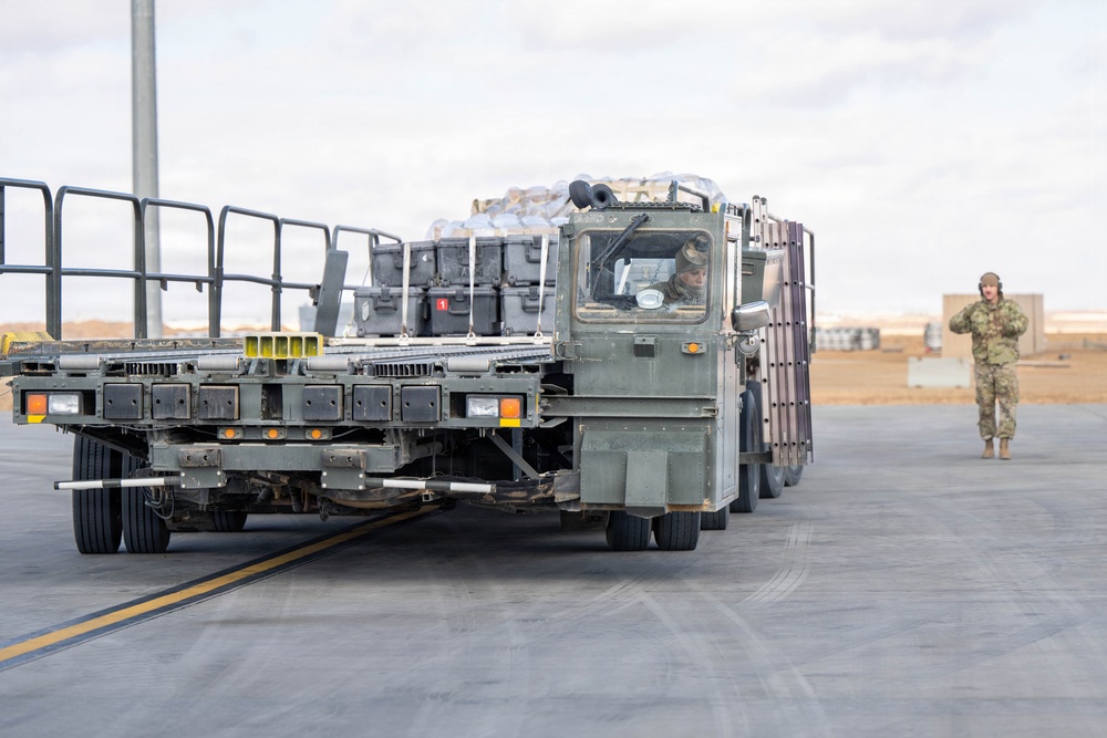 332nd Expeditionary Logistics Readiness Squadron loads pallets on C-17