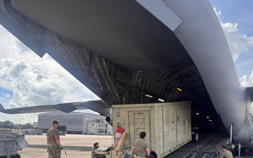 Airmen from the 113th Contingency Response Squadron transport cargo for Exercise Sentry Aloha