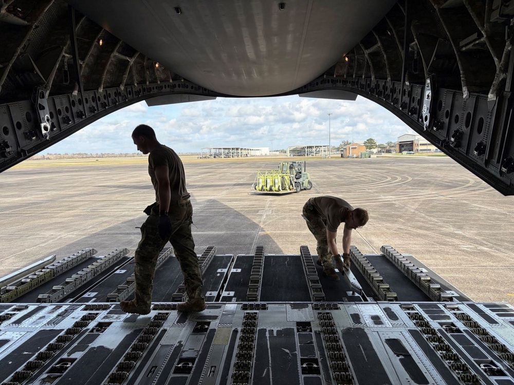 Airmen from the 113th Contingency Response Squadron transport cargo for Exercise Sentry Aloha