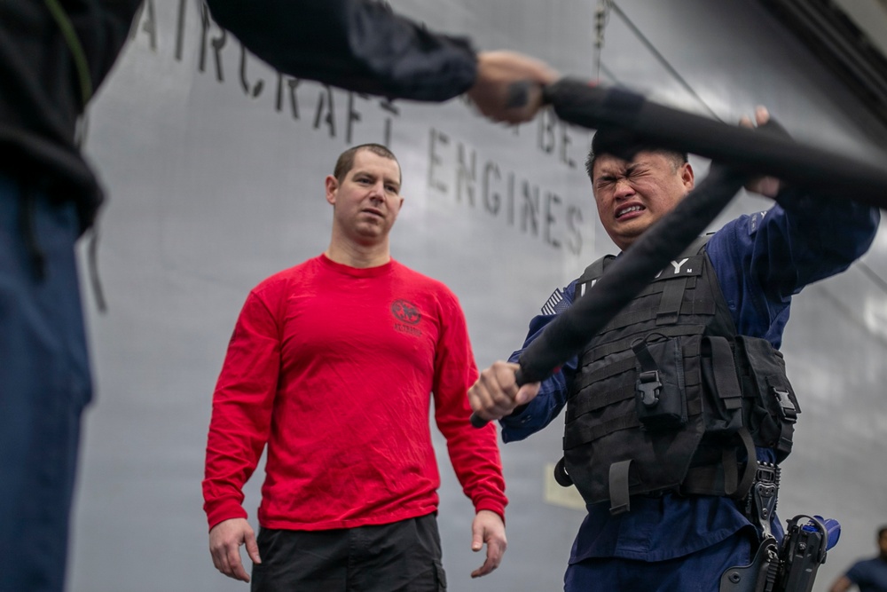 USS Tripoli Sailors Go Through the Non-Lethal Weapons Course