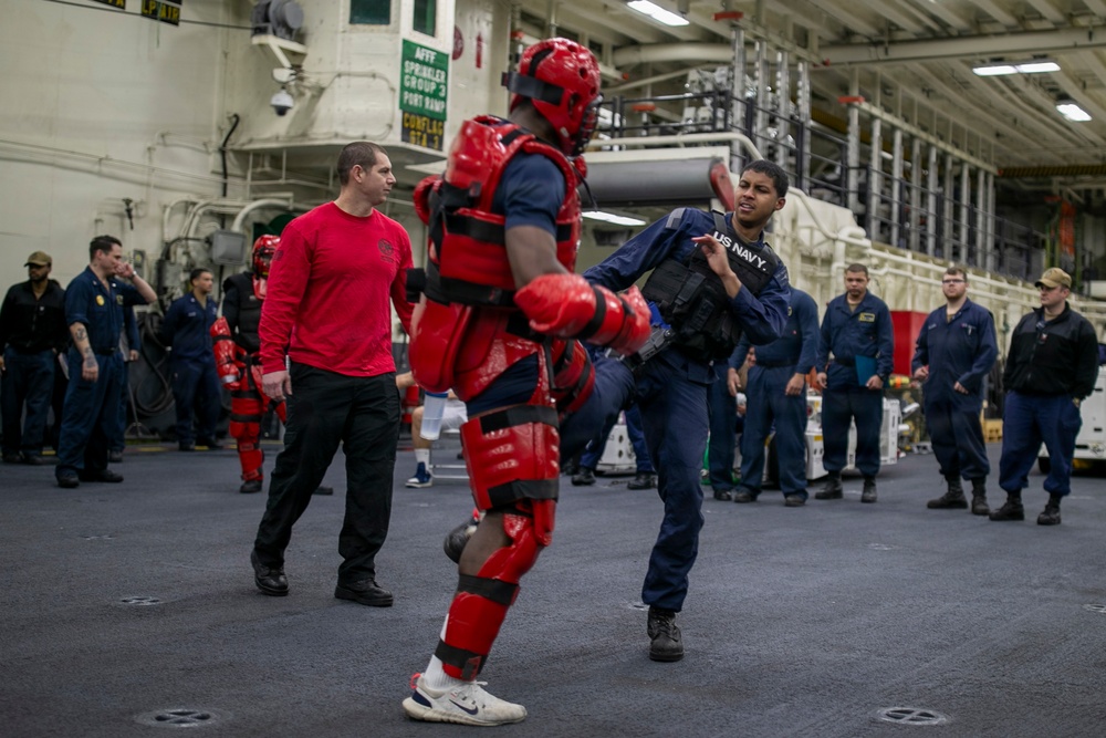USS Tripoli Sailors Go Through the Non-Lethal Weapons Course